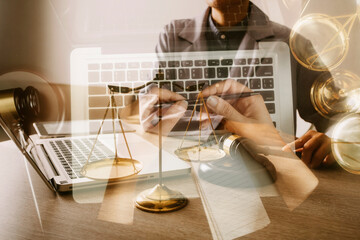 Male lawyer working with contract papers and wooden gavel on tabel in courtroom. justice and law ,attorney, court judge, concept.