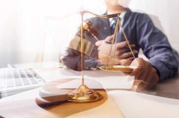Male lawyer working with contract papers and wooden gavel on tabel in courtroom. justice and law ,attorney, court judge, concept.