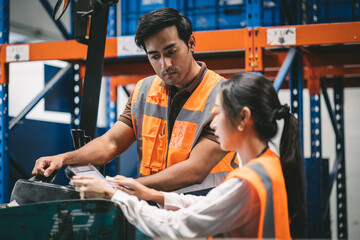 Warehouse worker and manager checks stock and inventory with using digital tablet computer in the retail warehouse full of shelves with goods. Working in logistics, Distribution center.