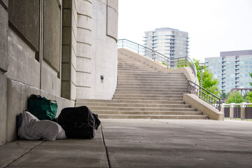 Homeless person's belongings under a bridge