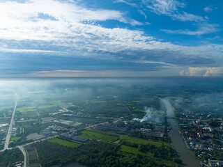 flying with bluesky day time with approching mist in horizon and river curve on bottom