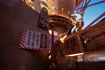 Safe workplace danger isolation tag signage placing on locking out equipment permit only operation...