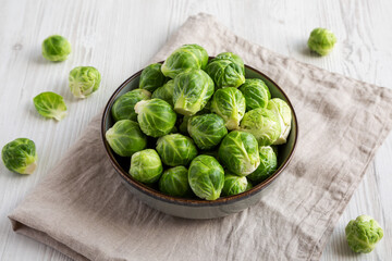 Raw Organic Brussel Sprouts in a Bowl, side view.