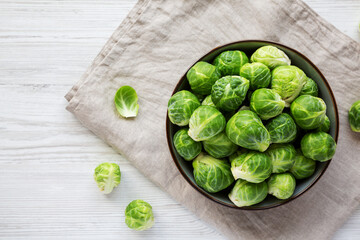 Raw Organic Brussel Sprouts in a Bowl, top view. Flat lay, overhead, from above. Copy space.
