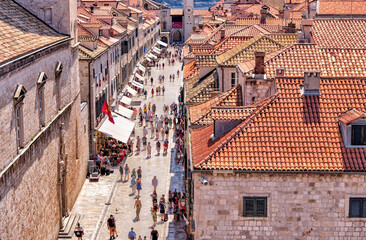 Tourists taking in the narrow streets and medieval architecture of Dubrovnik, Croatia