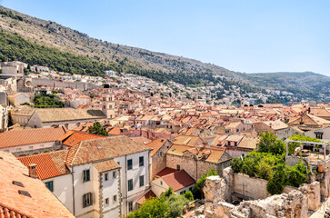 Medieval architecture in the walled city and the rugged coastline of Dubrovnik, Croatia with views of the Adriatic Sea