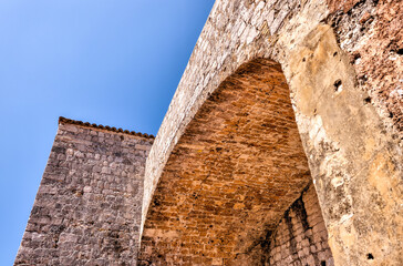 Medieval architecture in the walled city and the rugged coastline of Dubrovnik, Croatia with views of the Adriatic Sea