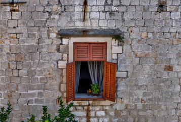 Medieval architecture in the walled city and the rugged coastline of Dubrovnik, Croatia with views of the Adriatic Sea