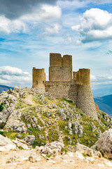 Fototapeta na wymiar The Castle of Rocca Calascio is a mountain top fortress in the Province of L'Aquila, Abruzzo, central Italy, Europe. Gran Sasso e Monti della Laga National Park. Tourist sightseeing. Vertical image.