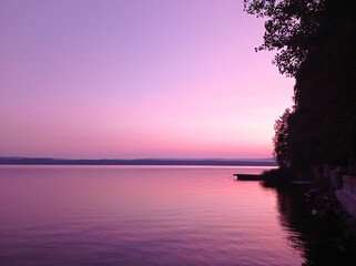 Photo of a pink sunset on the lake. Beautiful nature