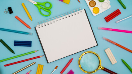 Back to school soon. buying stationery, flatlay, a place to copy your text or advertising on a white tablet. Bright background. photo 16:9