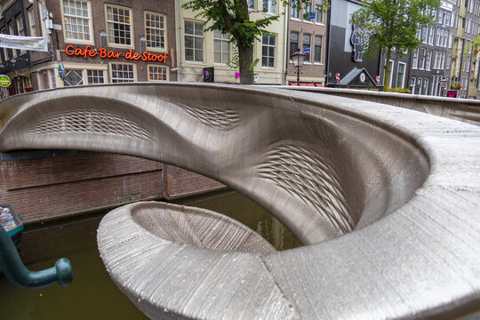 3d printed stainless steel bridge over canal in the red light district of Amsterdam