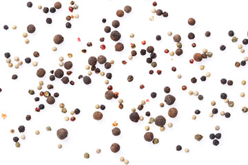 Several types of peppercorns on a white background with a light shadow. View from above. Top view.