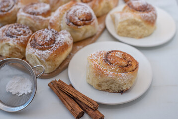 sweet home made cinnamon roll buns on a table