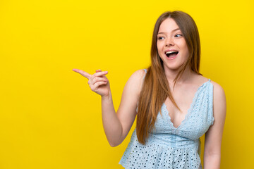 Fototapeta na wymiar Young caucasian woman isolated on yellow background intending to realizes the solution while lifting a finger up