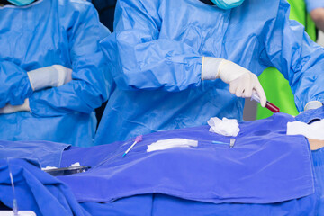 surgeon team working in operating room, Stem cells operation, Plasma in syringe, Health care concept.