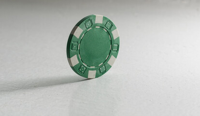A green isolated poker chip.