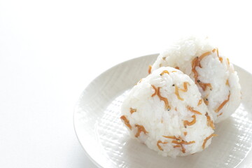 Japanese, pepper and small sardine fishes on white dish