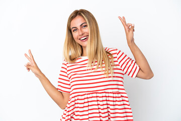 Blonde Uruguayan girl isolated on white background showing victory sign with both hands