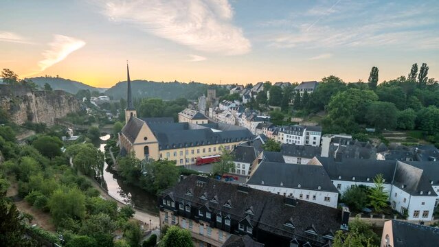 Grand Duchy of Luxembourg time lapse 4K, city skyline night to day sunrise timelapse at Grund along Alzette river in the historical old town of Luxembourg