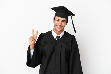 Young university graduate over isolated white background smiling and showing victory sign