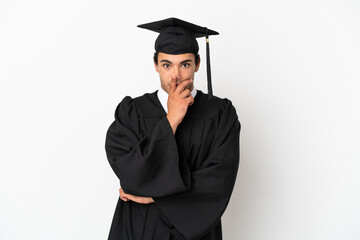Young university graduate over isolated white background surprised and shocked while looking right