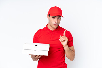 Pizza delivery caucasian man with work uniform picking up pizza boxes isolated on white background...
