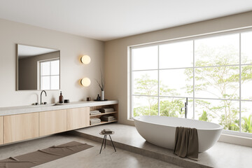 Fototapeta na wymiar Light bathroom interior with sink and tub near panoramic window