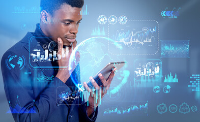 African businessman using tablet, graph chart with worldwide data and chart