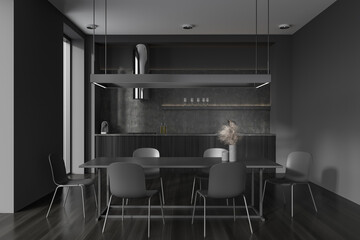 Front view on modern dark studio room interior with dining table