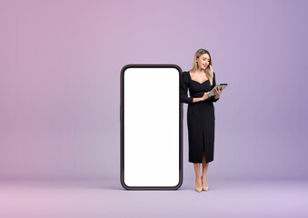 Businesswoman using tablet, mockup screen copy space on purple background