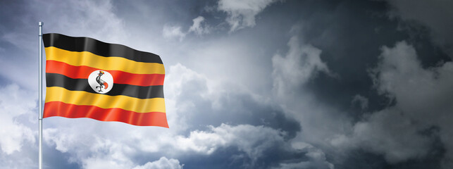 Uganda flag on a cloudy sky