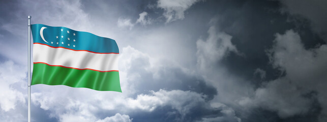 Uzbekistan flag on a cloudy sky