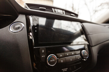 Fototapeta na wymiar Modern car interior with dashboard and multimedia