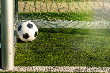 soccer ball in goal net