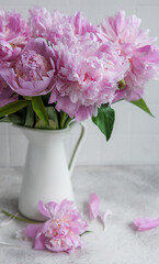 Beautiful bouquet of flowers: white and pink  peonies.