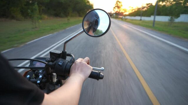 driving on the road ,Motorcycle driver riding having fun driving the empty highway on a motorcycle tour journey