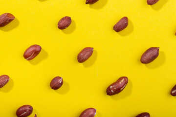 Pattern of peanuts. Fashionable sunny pattern of peanuts  on yellow background.
