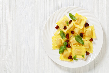 italian ravioli with chorizo ricotta filling on plate