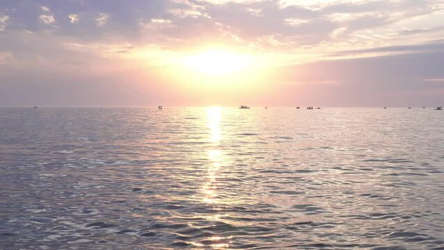 A beautiful sunset over the sea, a golden sunny path on the surface of the water. Beautiful evening sea or ocean.