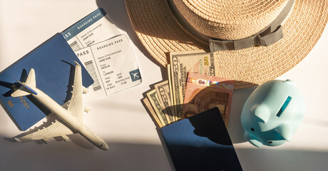 Save money for airplane tickets, planning travel budget concept. Airplane model, piggy bank on wooden table © Angelov