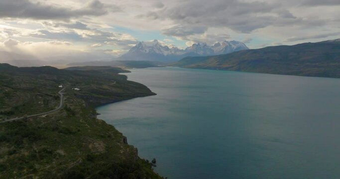 Aerial Backward Shot Of Torres Del Paine National Park By Lake Pehoe Under Cloudy Sky