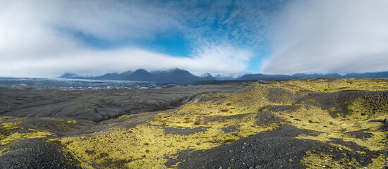 Iceland autumn tundra landscape near Haoldukvisl glacier, Iceland. Glacier tongue slides from the...