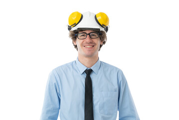 Portrait of Smiling young business man dressed in light blue formal shirt and black tie protective construction helmet isolated on white background.
