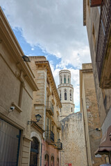 Fototapeta na wymiar Llers Street and Church of Sant Pere in Figueres, Spain.