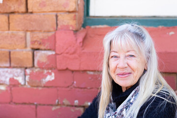 head and shoulders of fair middle-aged woman looking at camera