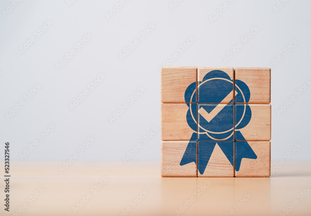 Poster Guarantee label tag print screen on wooden block for ISO quality standard of product and service , Best quality control assurance and certificate concept.