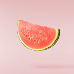 Fresh raw watermelon falling in the air isolated