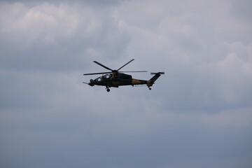 Naklejka na ściany i meble Attack helicopter flying overhead