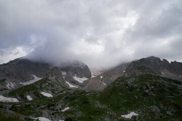 mountains with glacier in nepal and clouds on the peaks. mountain climbing